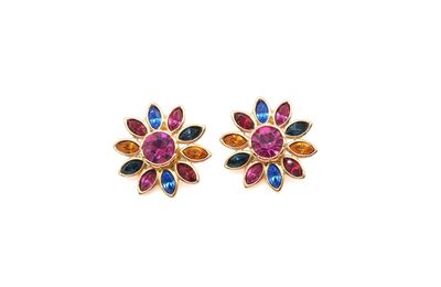 a pair of multicolored earrings on a white background