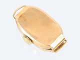 a close up of a gold ring with a clasp on a white surface