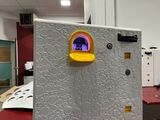 a refrigerator that has a picture of a dog in the window