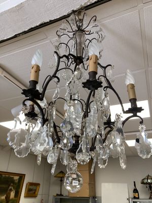a chandelier hanging from the ceiling in a room