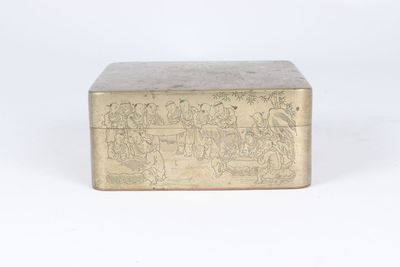 an antique brass box with a scene on it