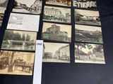 several old black and white photos of buildings and buildings on a table