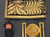 a close up of a gold and black purse next to a pair of scissors