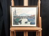 a picture of a painting on a easel with a black background