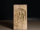 an image of a stone statue of a buddha on a black background