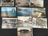 several old postcards of old photos of a city and a beach