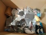 a cardboard box filled with assorted items in it