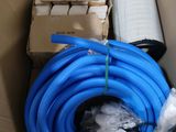 a box with a bunch of blue hoses inside of it