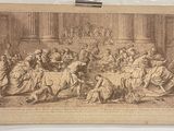 une vieille photo d'un groupe de personnes assises autour d'une table
