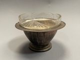 a glass bowl that is sitting on a table
