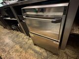 a stainless steel oven in the middle of a kitchen
