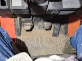 a close up of a person ' s feet and foot pedals on a vehicle