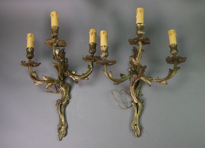pair of antique brass wall sconces with flowers and leaves