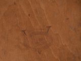 a picture of a wooden table with a crown on it