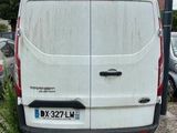 a white van parked on the side of the road