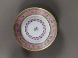 a close up of a plate with a flower on it