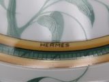 a close up of a plate with a flower design on it