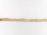 an old piece of wood is hanging on a white wall