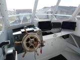 a steering wheel on a boat that is in the water