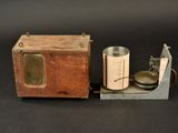 a small wooden box that has a cup and a kettle on it