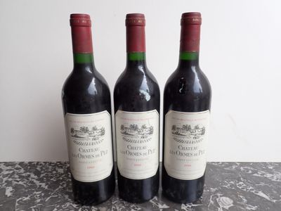 three bottles of wine sitting on top of a table next to each other