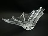 a glass bowl that is sitting on a table