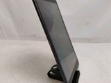 a close up of a tablet computer on a stand on a white surface
