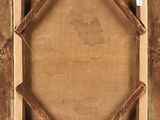 an old wooden frame with a picture hanging on a wall