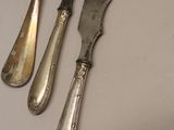 three knives and a knife on a table