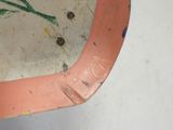 a close up of a piece of metal with paint on it