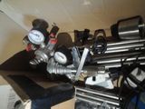 a picture of a bunch of pipes and gauges on a table