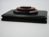 a black and red object on top of a white table