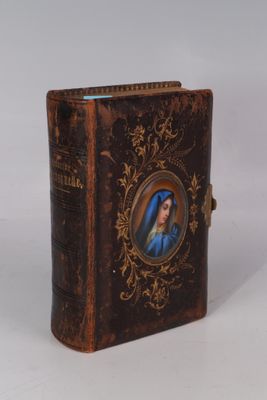 a small book with a picture of a woman on it