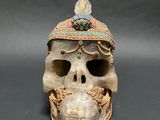 a close up of a skull with a hat on it ' s head