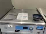 a machine that has a bowl on top of it
