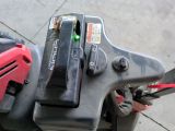 a close up view of a tool holder on a moped