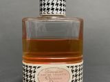 an image of a bottle of liquor sitting on top of a table