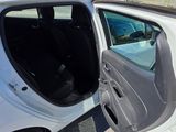 a white car with its door open on the side of the road
