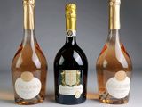 three bottles of wine sitting next to each other on a table