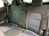 the back seats of a car with two rows of seats in it