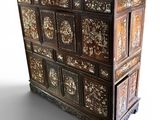 a wooden chest of drawers with many drawers on top of it