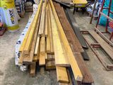 several pieces of wood are stacked on top of each other in a garage