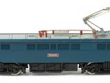 a blue train with a crane on the side of it