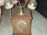 an old fashioned telephone sitting on a table in a room