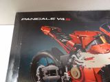 a box with a lego motorcycle on it on a table