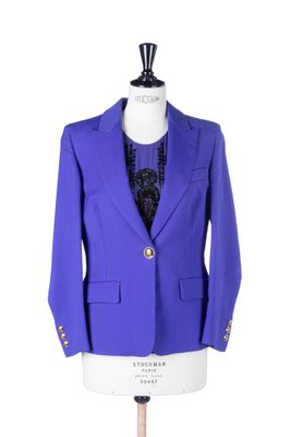 purple blazer on a mannequin dummy with a black tie