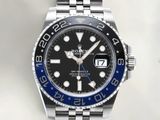 a close up of a wrist watch with a black and blue dial