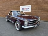 an image of a classic car parked in front of a building
