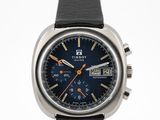 a close up of a wrist watch with a blue dial