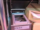 a machine that is sitting on the floor next to a box